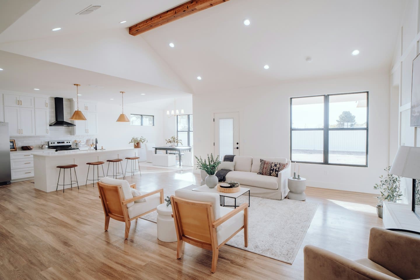 Open concept living space with kitchen, dining, and living room.